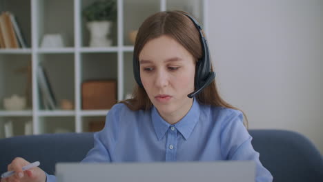 specialist-of-tech-support-or-call-center-is-consulting-client-online-woman-with-headphones-is-answering-on-call-by-laptop